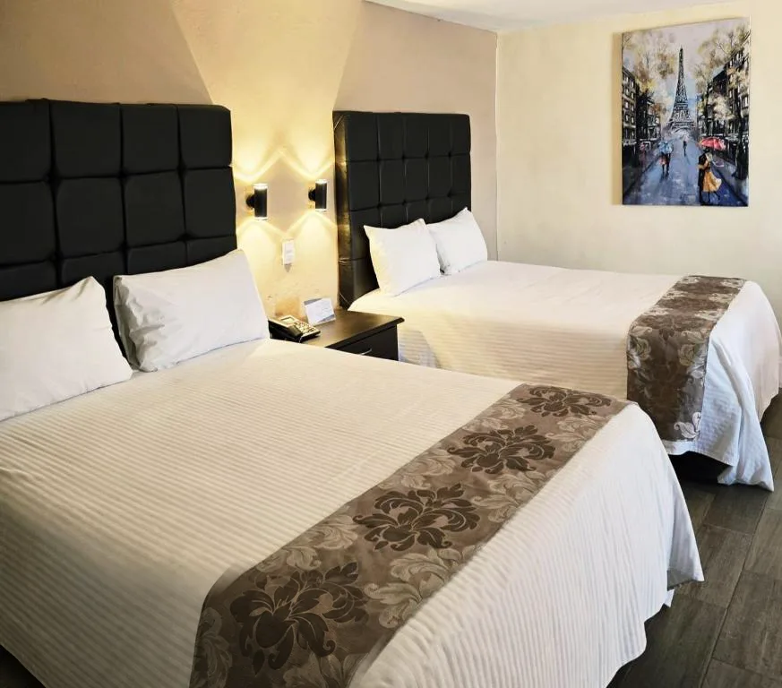 Hotel Express Inn guest room with two double beds